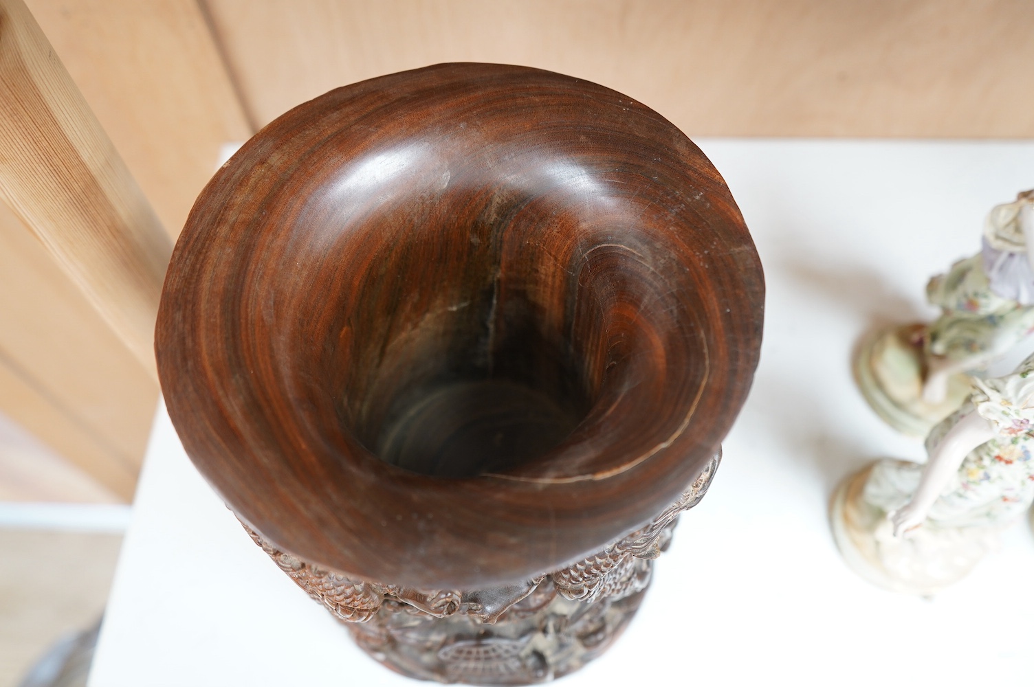 A 20th century Chinese carved hardwood ‘dragon’ brush pot, 22.5cm high. Condition - fair to good